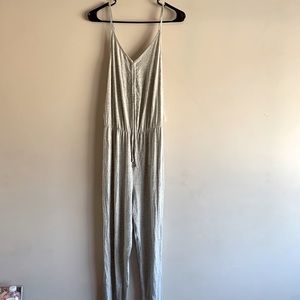 New grey jumpsuit, still has the tag on.